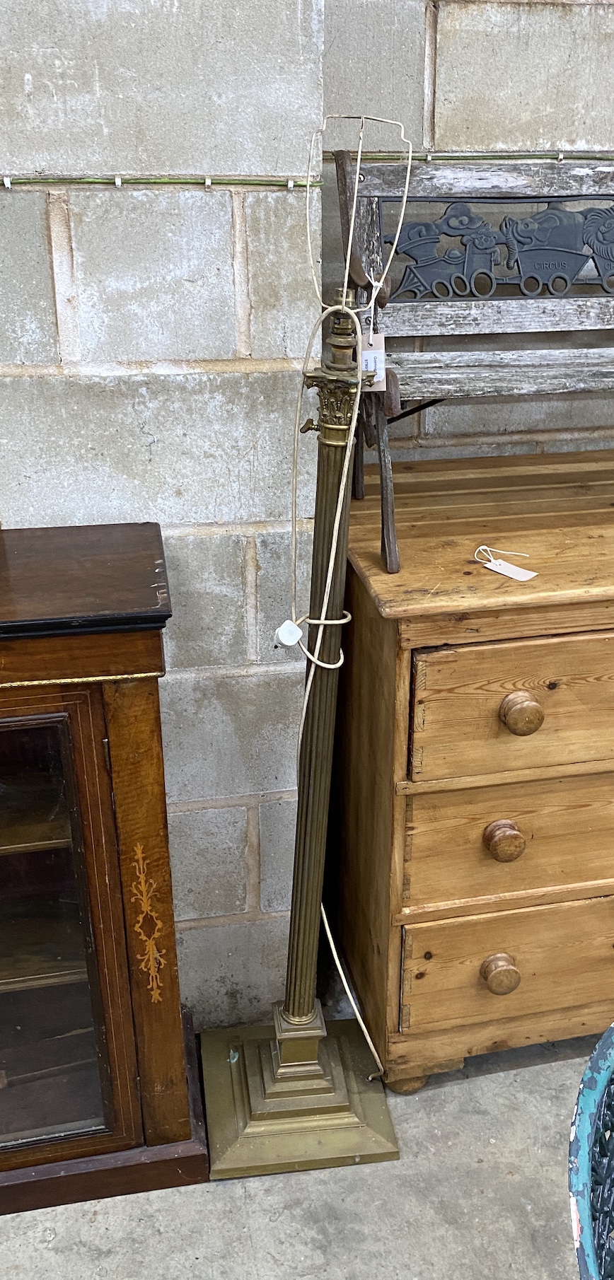 An Edwardian brass Corinthian column telescopic lamp standard